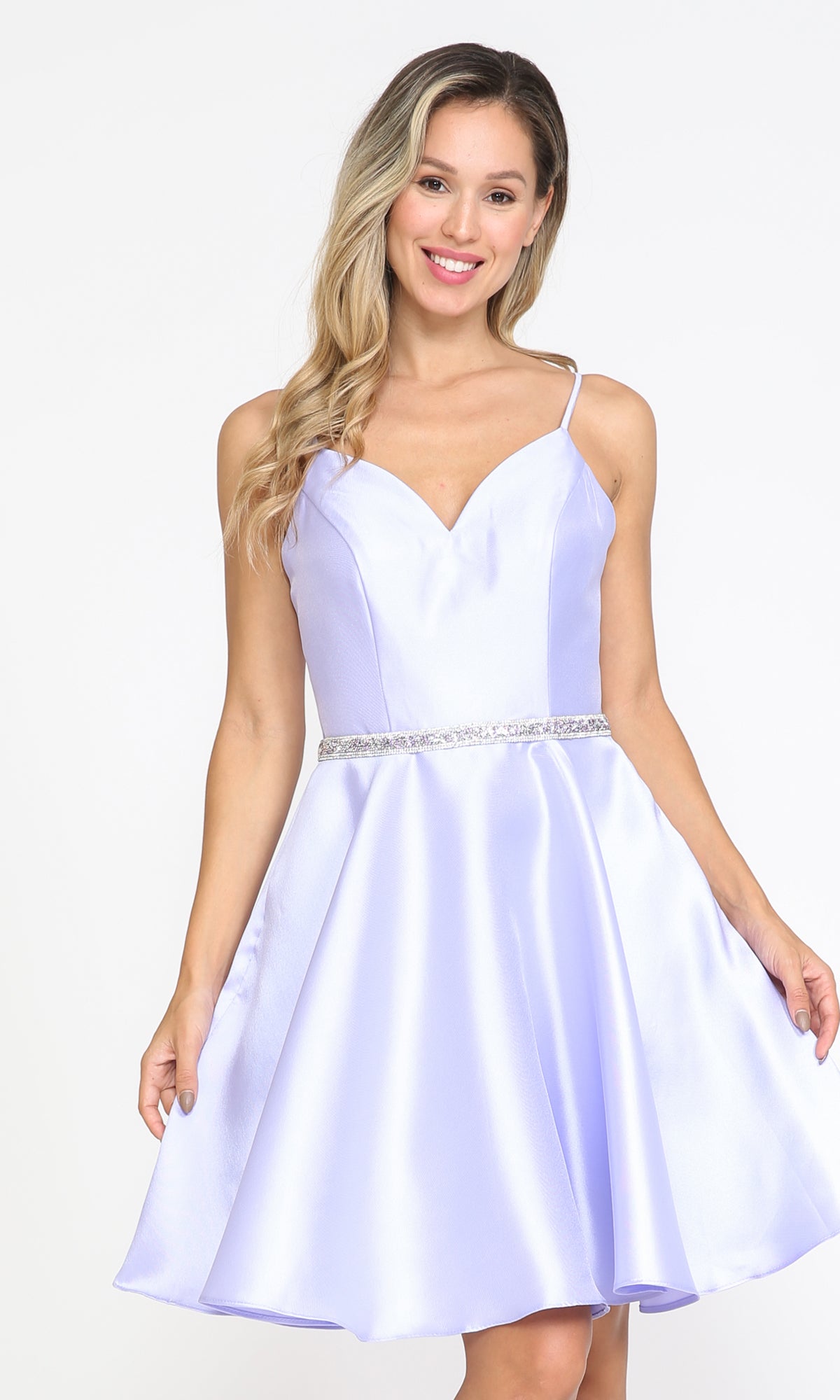 A woman models the lilac Short Mikado Homecoming Dress 8420 with spaghetti straps, jeweled waistband, and handy pockets—ideal for parties and available for under $150.